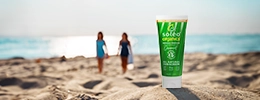 Soléo Organics sunscreen on the beach in front of some young women